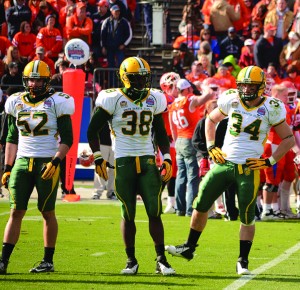 (left) Travis beck, (right) Grant Olson and me wait for the defensive play call during my first start in the 2012 FCS Championship against Sam Houston State. 