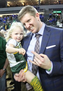 Photo by Gabrielle K. Hartz - Dave Richman and his daughter Ellie celebrate on the court after the Bison victory over South Dakota State in the Summit League championship game.