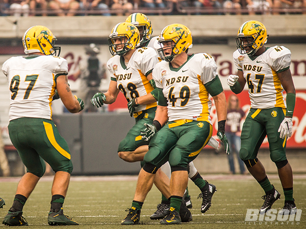 Nick DeLuca celebrates with his teammates after the Bison stopped Montana