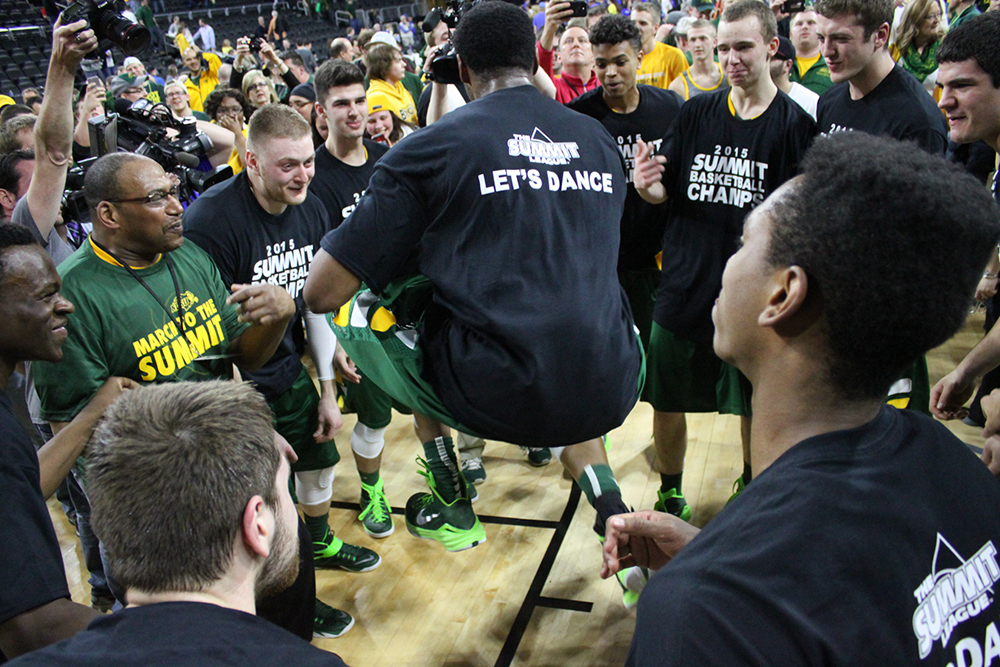 Kory Brown jumps in celebration after North Dakota State wins the 2015 Summit League tournament championship