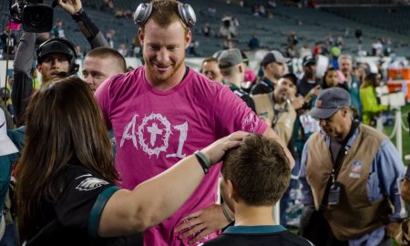 Carson Wentz speaks to the Kusters family before his Monday Night Football game against Washington in October.